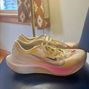 Nike White and Pink Athletic Shoes with Sleek Design